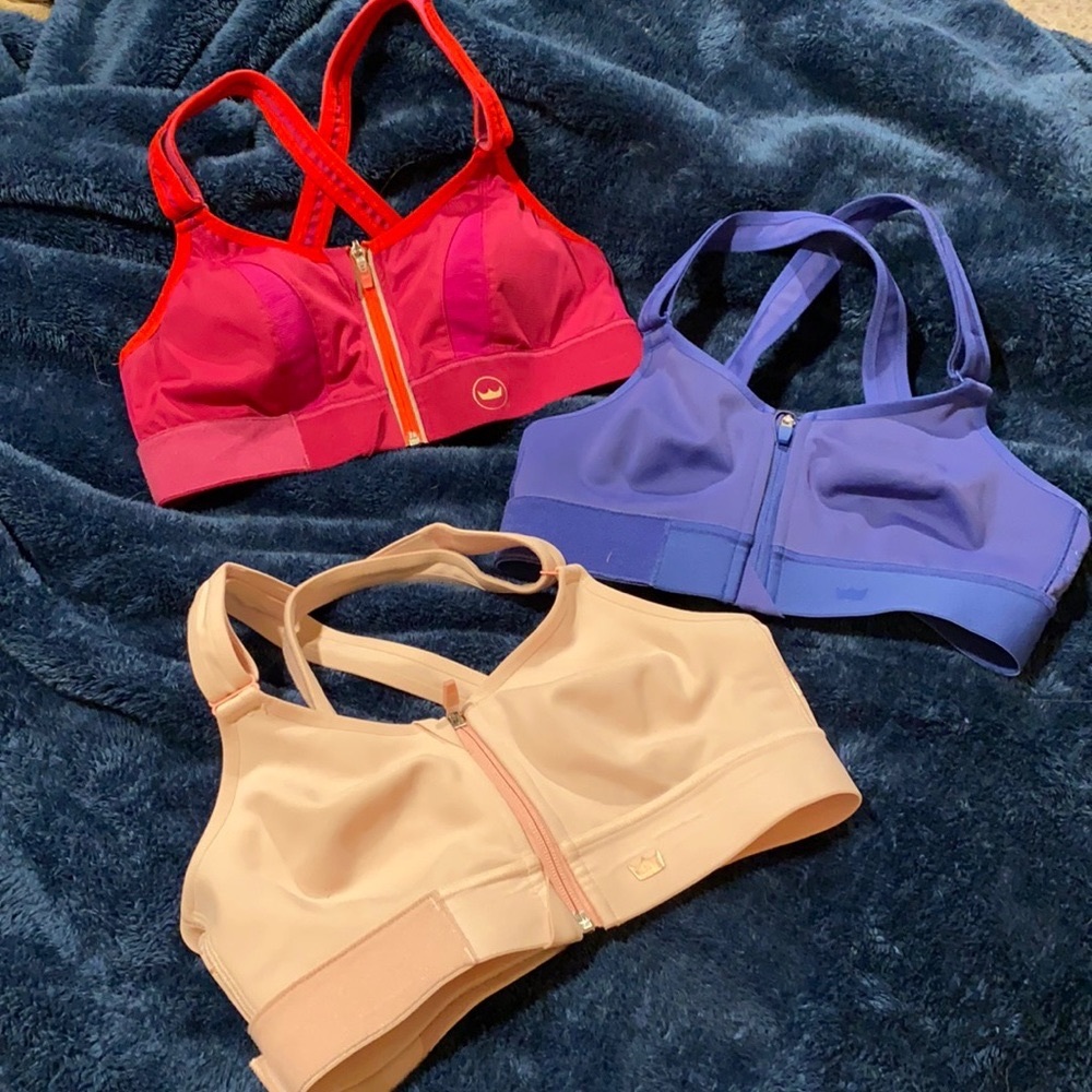 A pair of SheFit bras. (Bright pink one is sold)